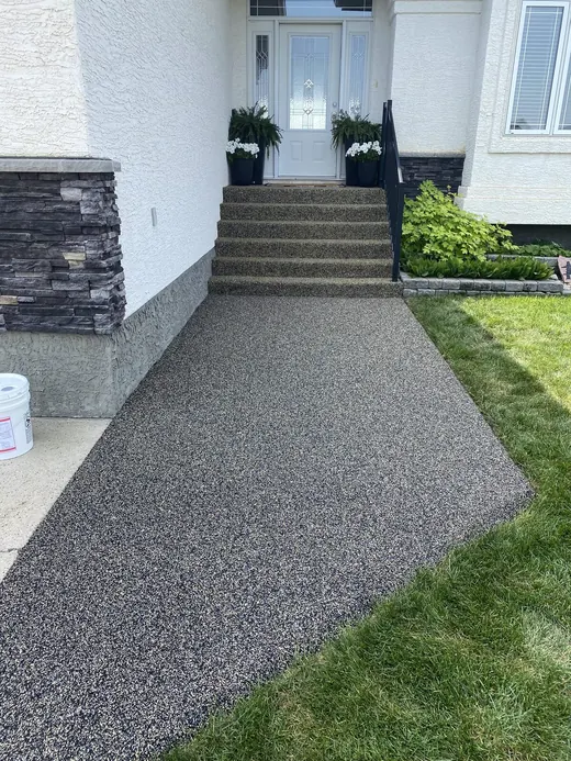 Black rubber steps leading to a front door
