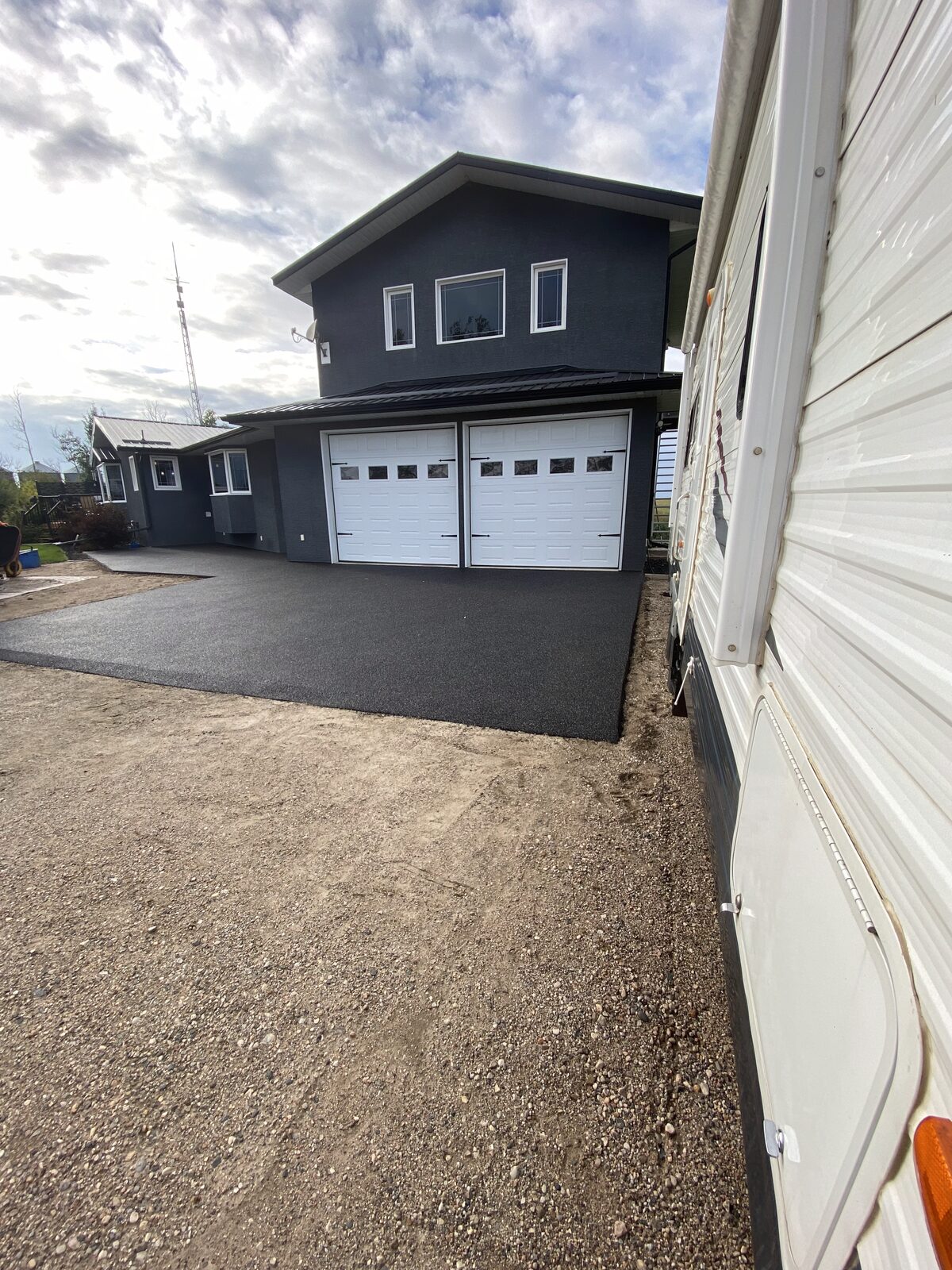 Rubber driveway and entryway leading to a garage