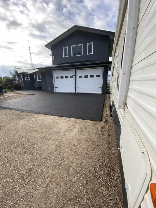 Rubber driveway and entryway leading to a garage