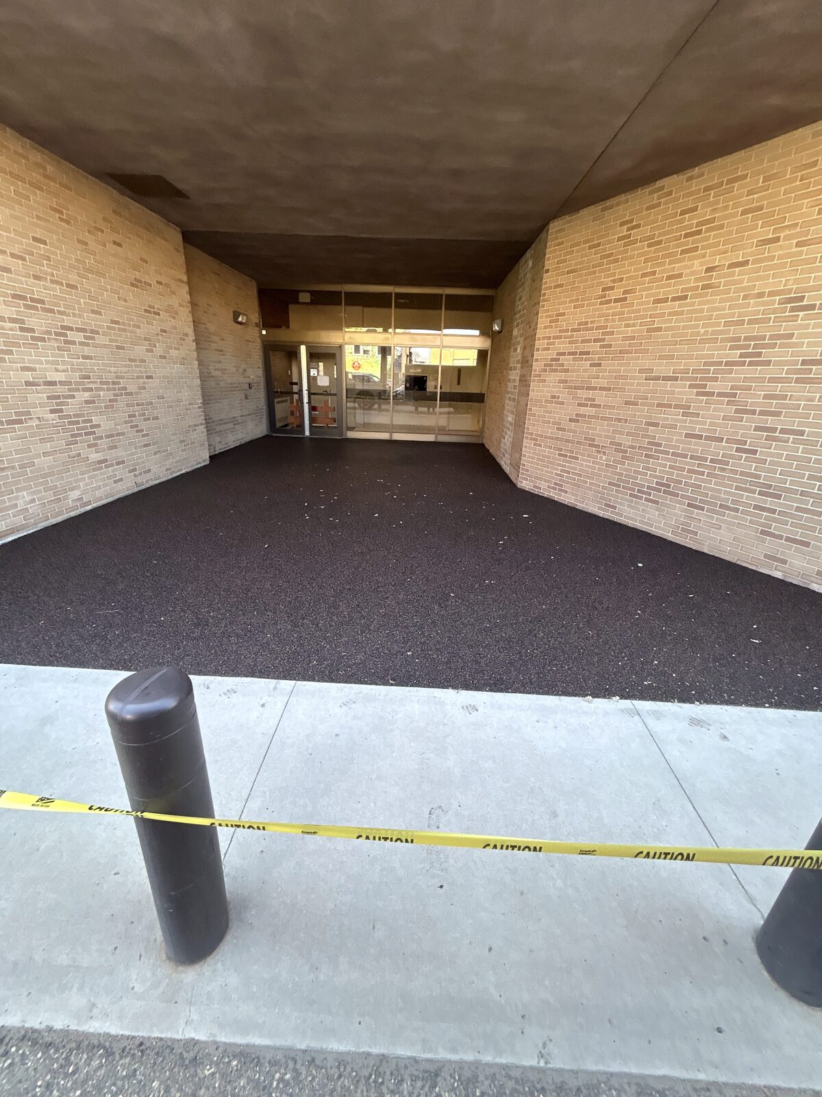 Rubber-surfaced covered entryway